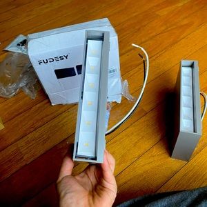 Dual sided wall-mounted LED light for anywhere includes hardware to mount.